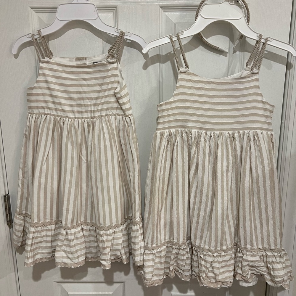 $20 for both Tahiti Girls' Cream and White Striped Sundress - Ruffle Hem.